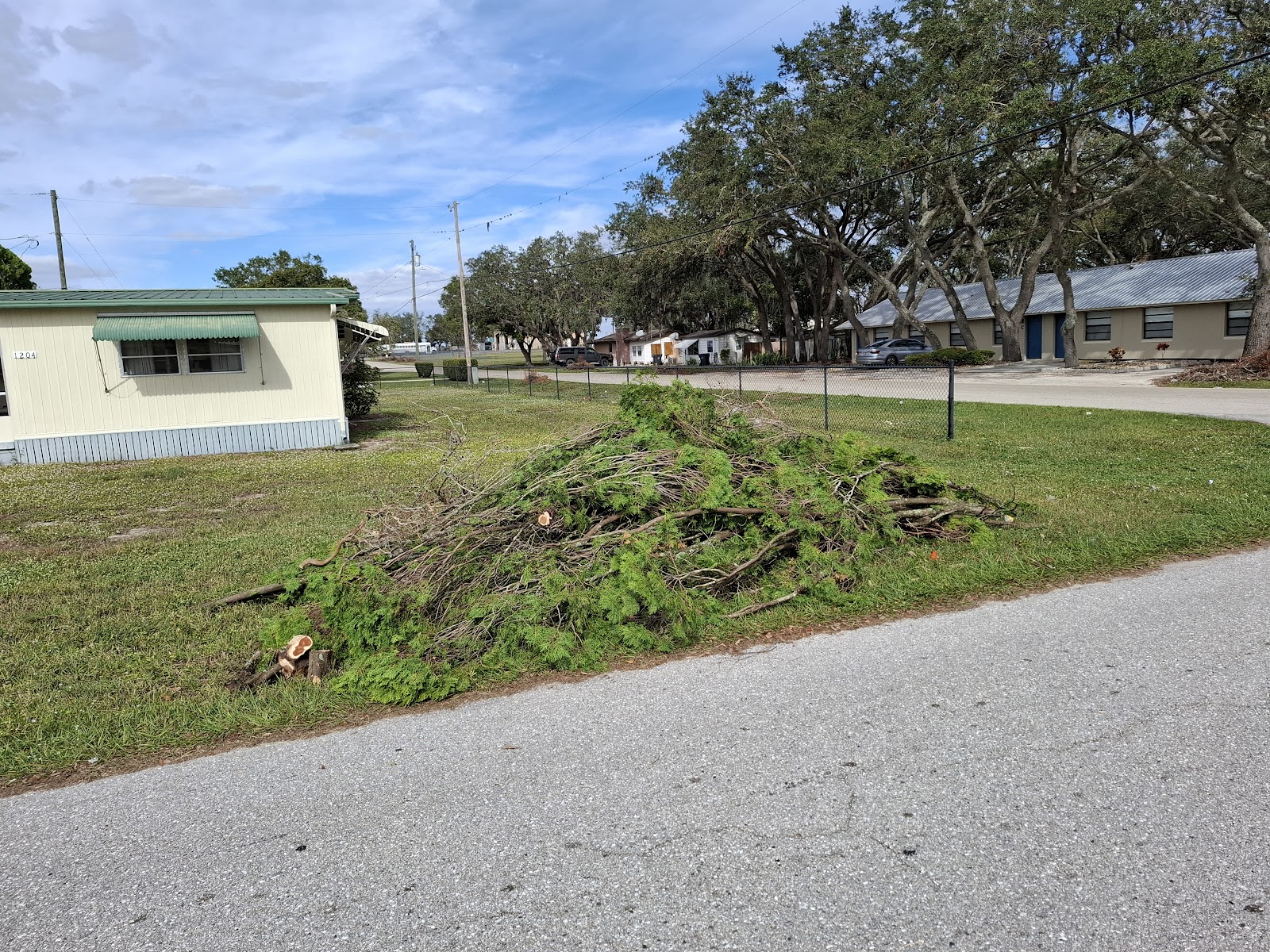 Grandson's Services truck and dump trailer loaded on a job in Avon Park, Florida